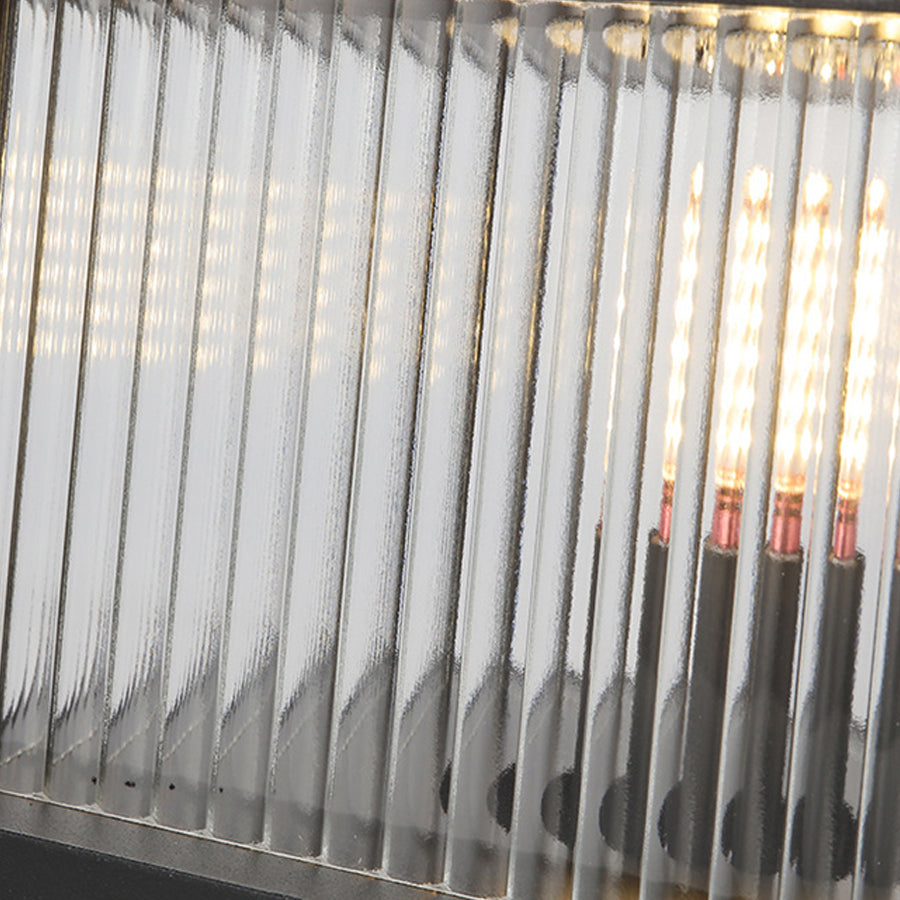 Metal fence picket detail showing solar outdoor pillar lights integration with residential fencing systems