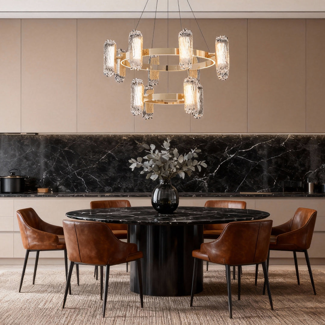 Metal modern chandelier creating sophisticated ambiance in elegant dining space with dark circular table setting