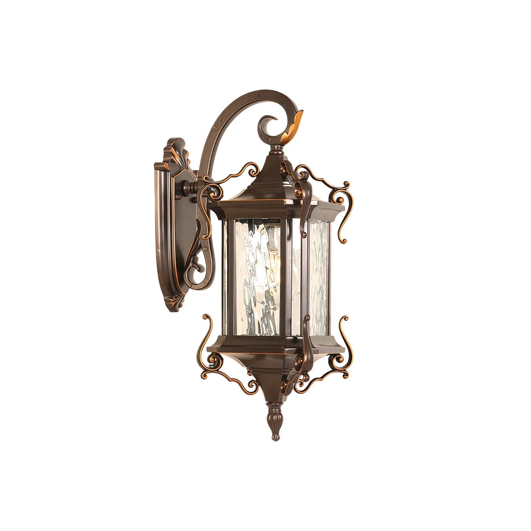 Metal outdoor wall sconce product image featuring a bronze lantern body, clear textured glass, and decorative curved arm.