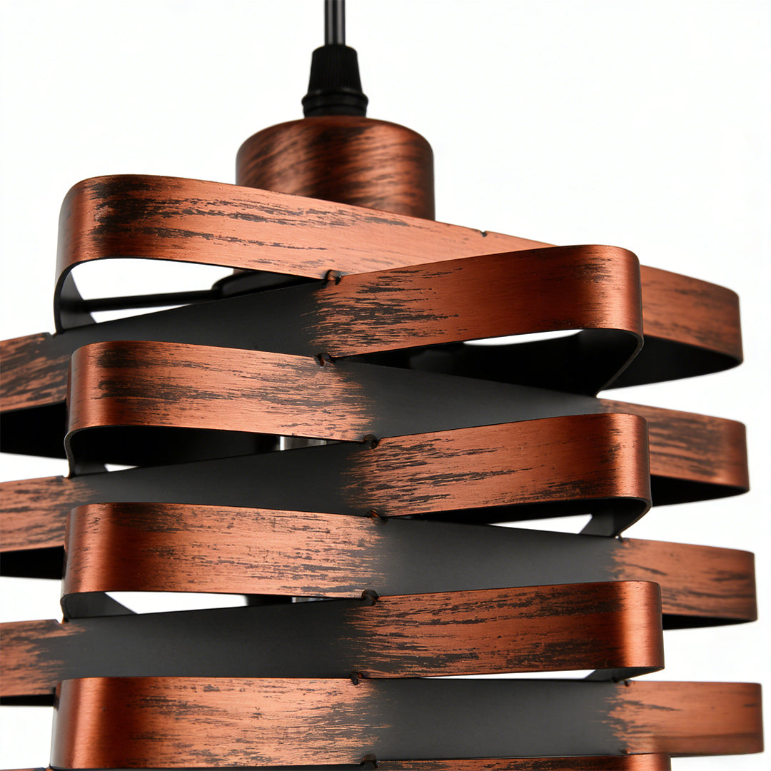 Metal ribbon pendant light showing sculptural spiral ribbon design.