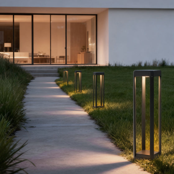 Metal solar pathway lights illuminating a modern garden walkway, providing eco-friendly and stylish lighting.