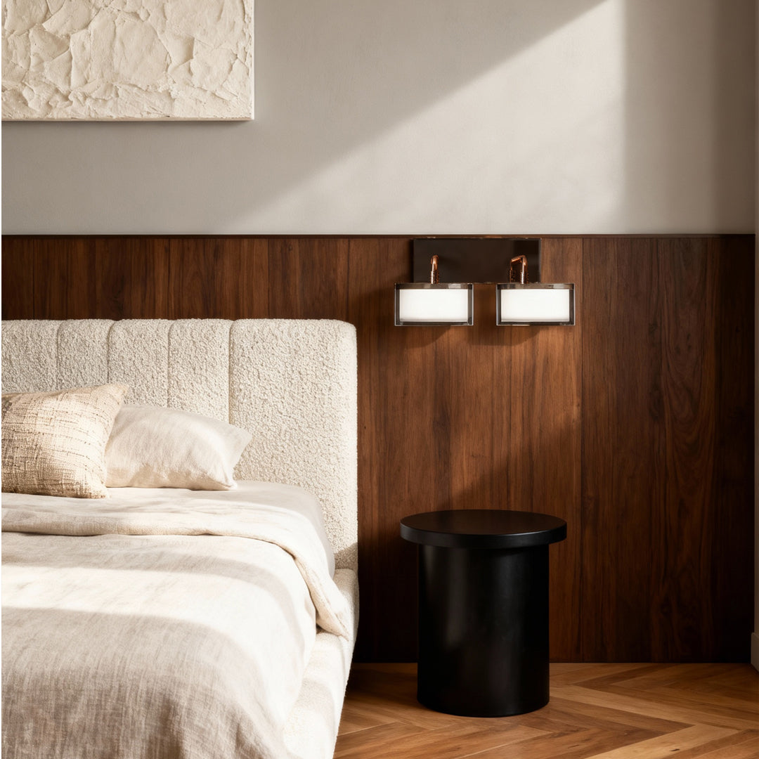 Metal wall art with led lights flanking bed in minimalist bedroom with rich wood paneling and neutral decor