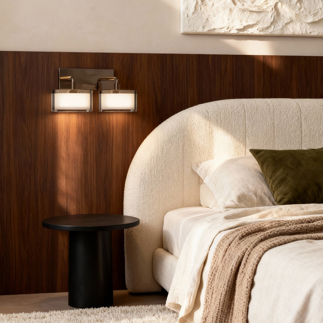 Metal wall art with led lights creating symmetrical lighting above wooden headboard in warm neutral bedroom setting