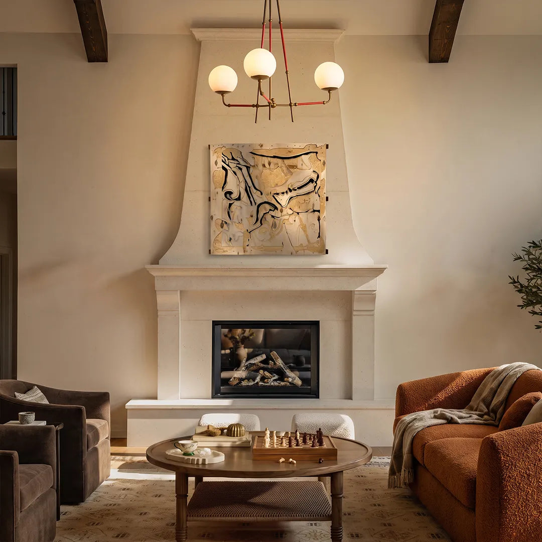 Mid century modern chandelier centered above a living room with a fireplace and neutral seating.