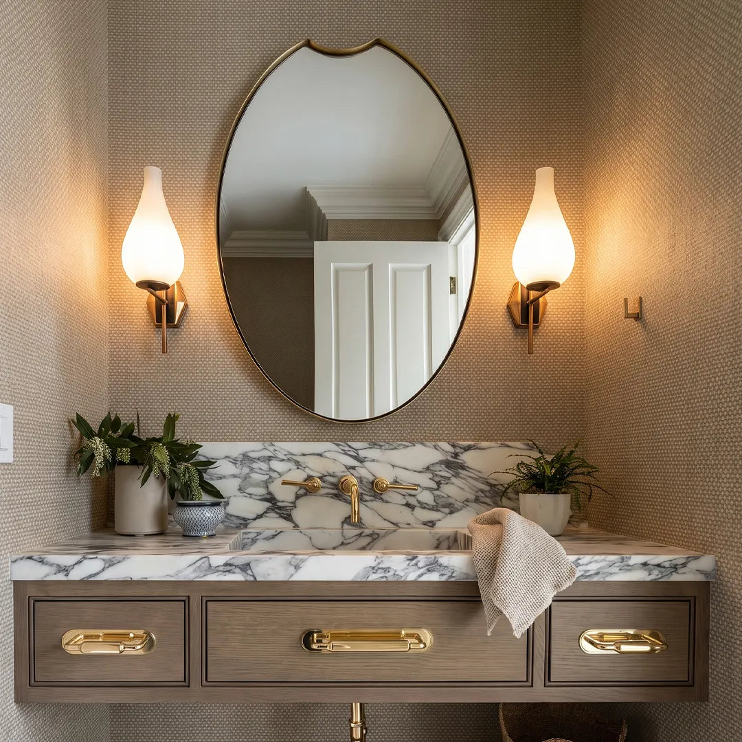 Mid century modern wall light pair beside a bathroom mirror with warm ambient lighting.