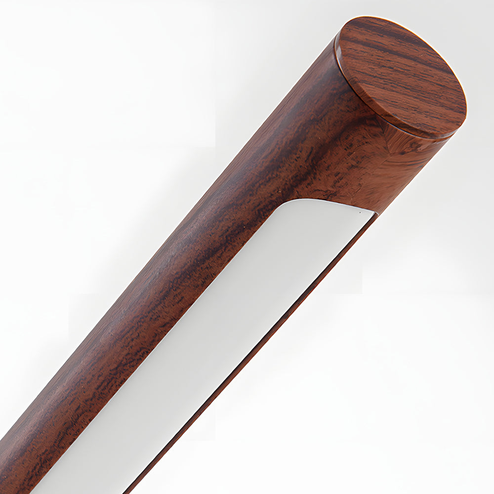 Mid century modern wood and brass lamp with a close-up of the brass joint.