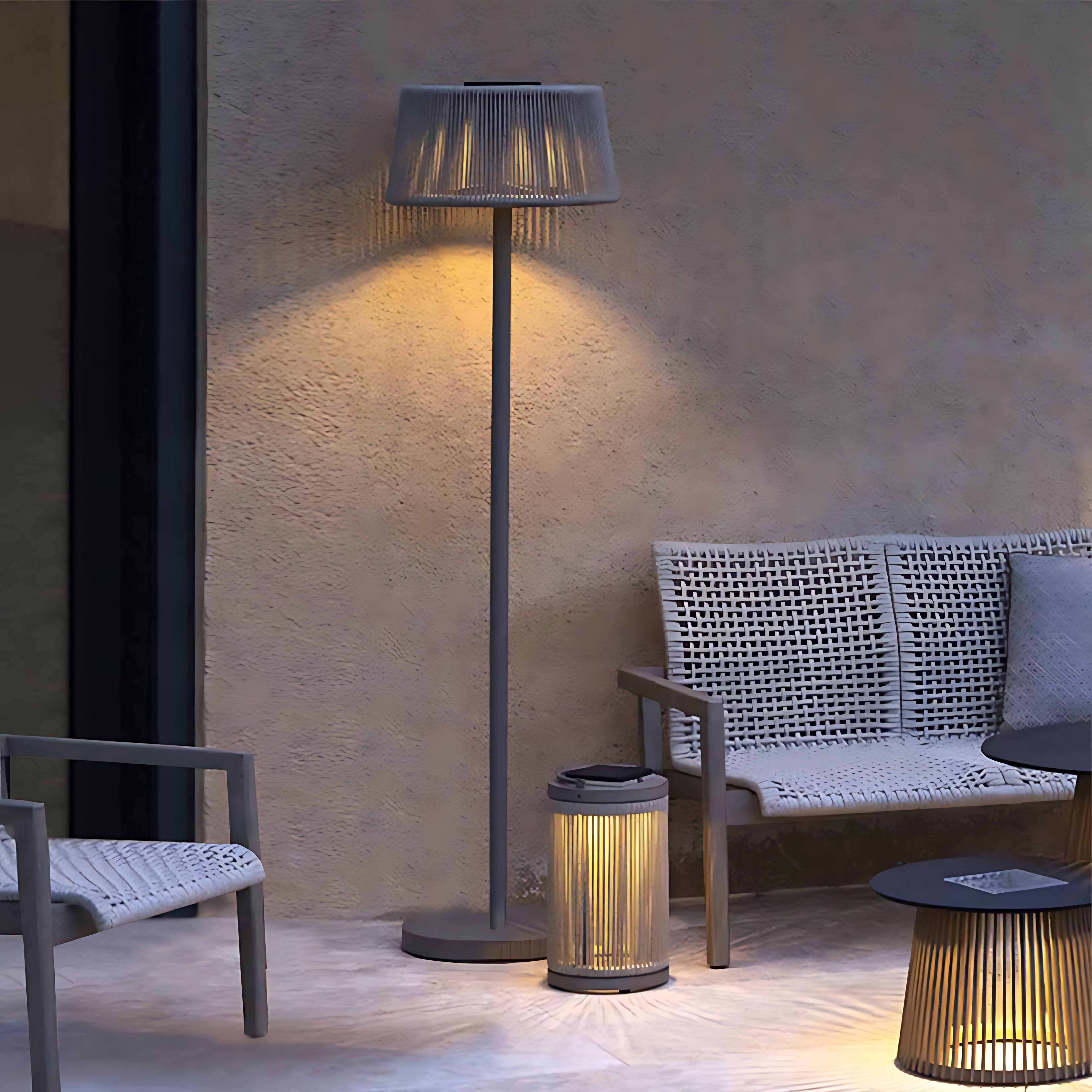 Silver Metal Table Lamp mid-century modern floor lamp with woven shade creating warm ambient lighting on contemporary outdoor patio