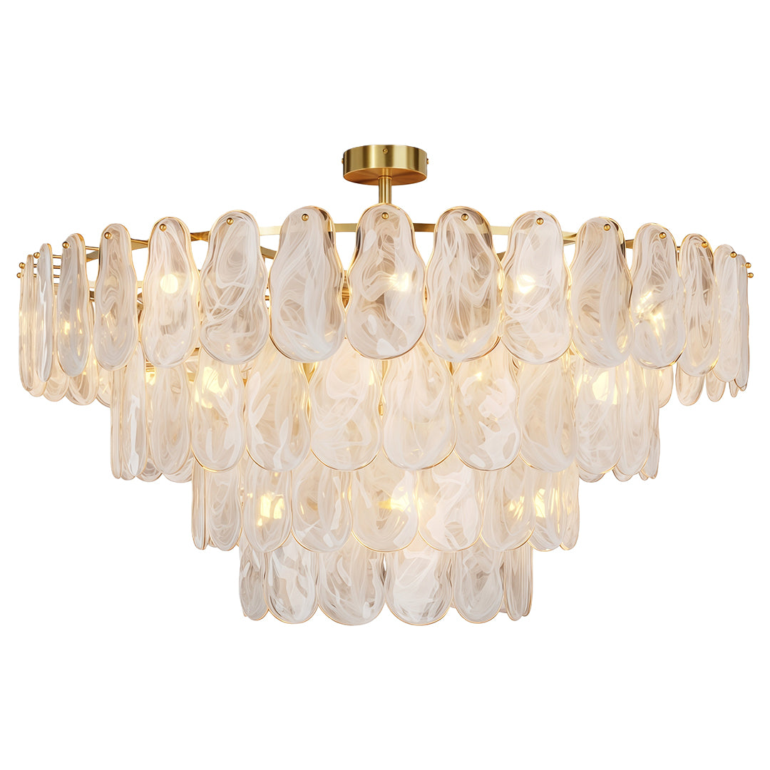 Modern luxury chandeliers close up showcasing brass chain and frosted glass panel detail.