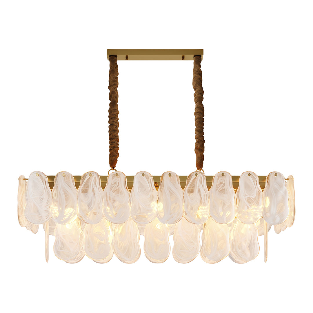 Midcentury modern chandelier above contemporary dining table with brass accents and designer chairs.