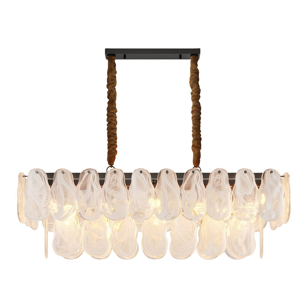 Midcentury modern chandelier lighting elegant dining space with round fluted table.