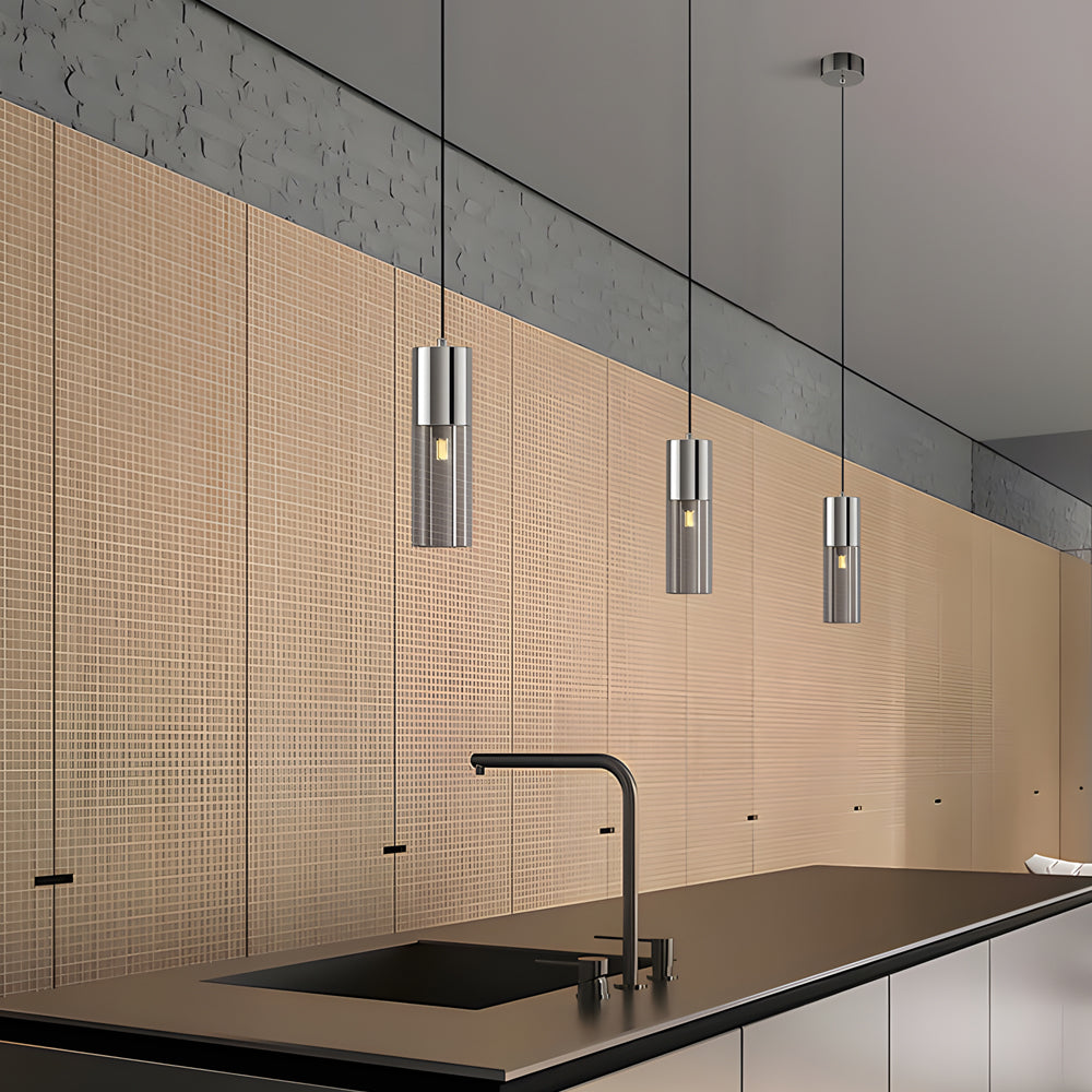 Mini black pendant lights installed above a modern kitchen island