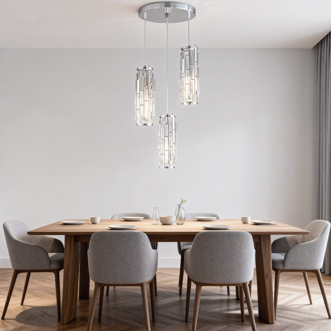 Mini crystal pendant lights suspended above a modern dining table.
