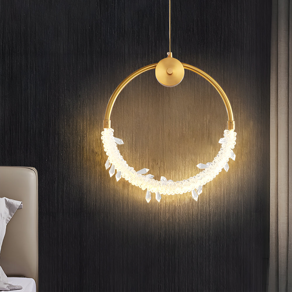 Mini crystal ring pendant light with a golden frame, enhancing a stylish bedroom.