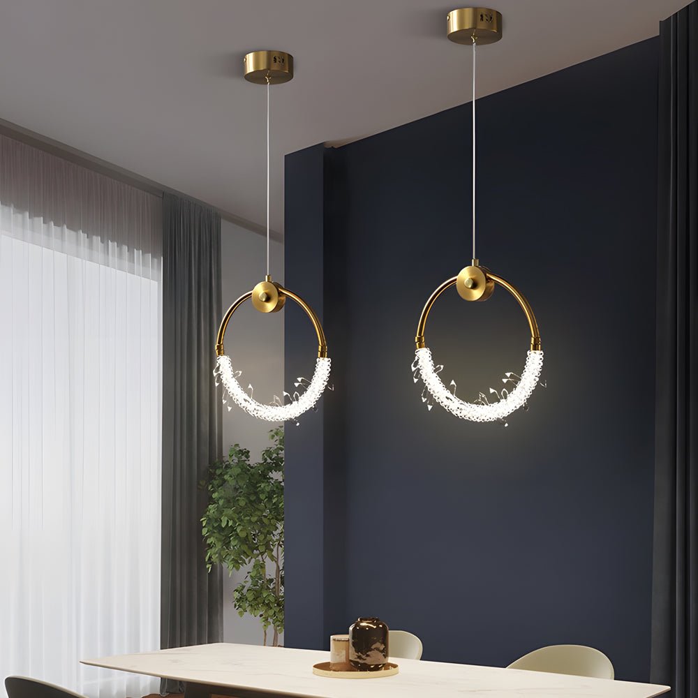 Mini crystal ring pendant light with a modern design, mounted on a dark accent wall.
