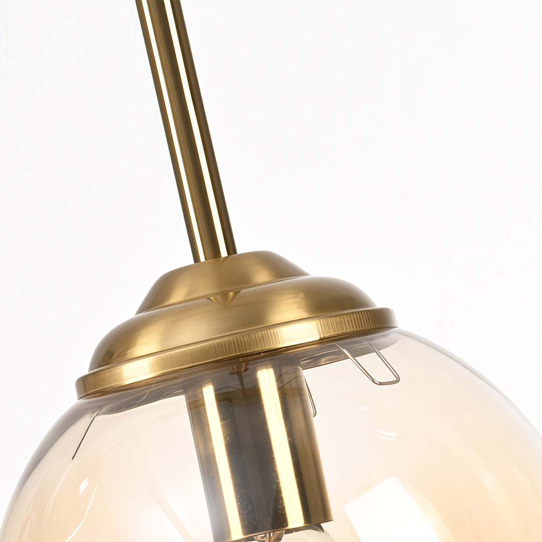 Mini gold pendant light in gold, front view of the modern design.