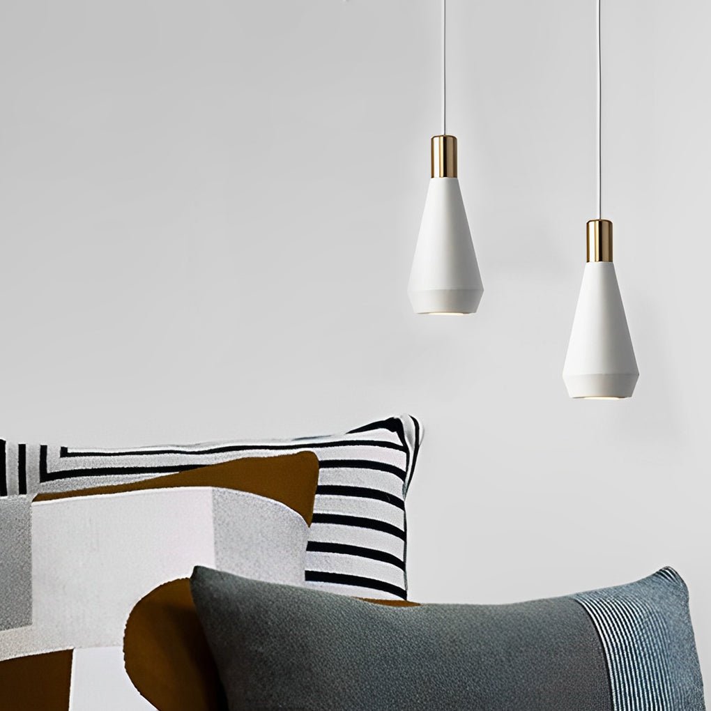 Mini hanging pendant lights over a sofa corner, enhancing a modern living space with subtle decorative illumination.