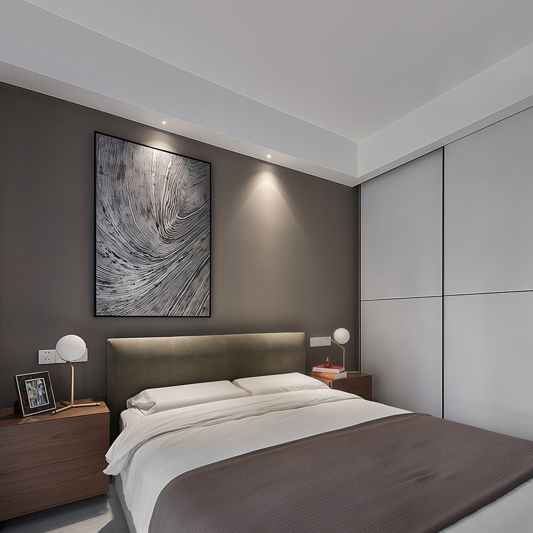 Mini LED spotlights illuminating contemporary bedroom with dark accent wall and upholstered headboard