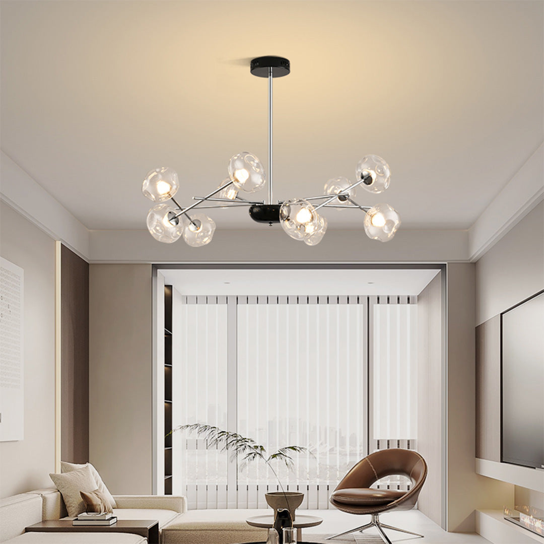 Designer LED chandelier lights enhancing minimalist bedroom interior with artistic glass sphere arrangement