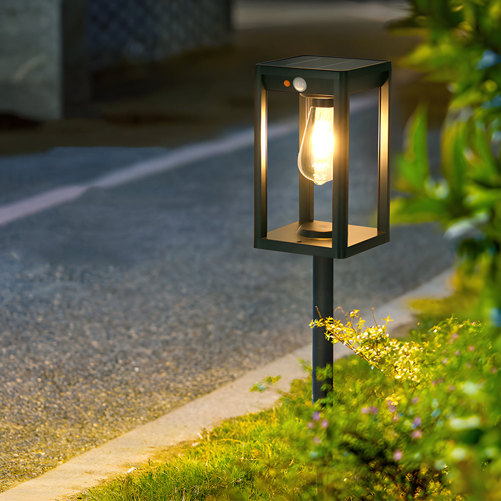Illuminated pathway featuring lantern-style stake lights creating warm ambient lighting along walkway