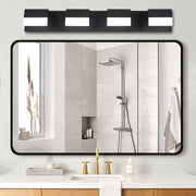 Minimalist black vanity lighting for bathroom featuring glass shade chandelier inspired bar design framing modern mirror.