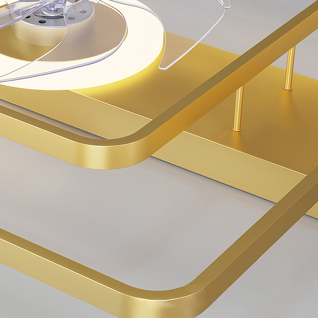 Angled view of minimalist ceiling fan with light highlighting gold finish and transparent blade construction