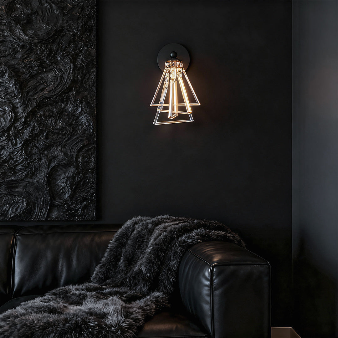 Minimalist crystal wall lights featuring glass shade chandelier design providing dramatic illumination on dark textured accent wall.