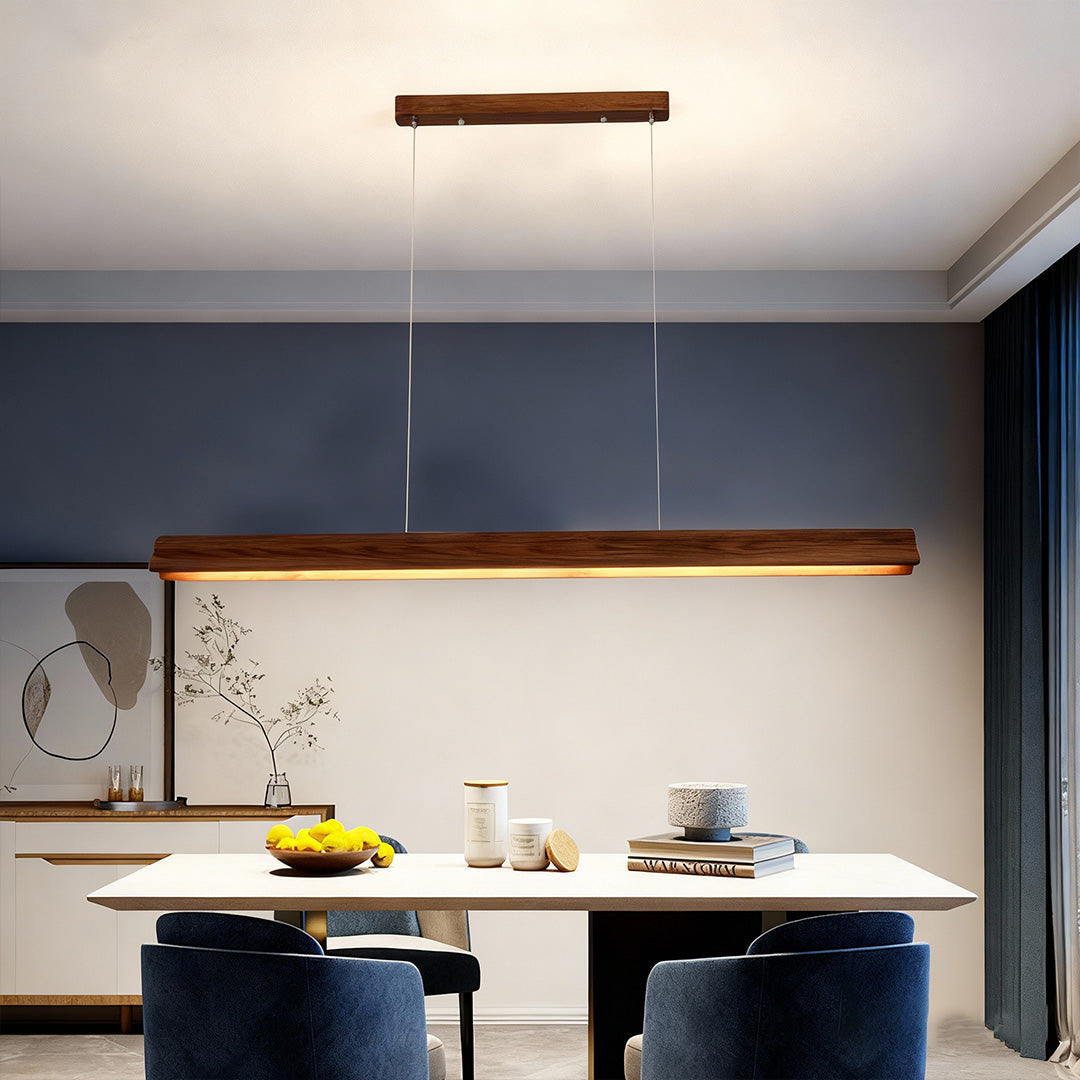 Wood pendant light in a minimalist dining space, sleek and natural lighting design
