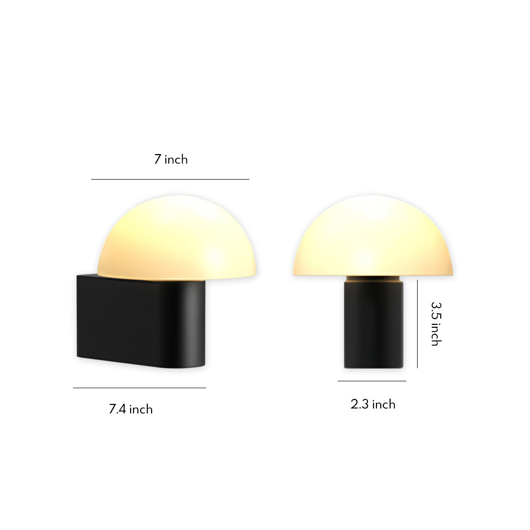 Minimalist dome-shaped outdoor wall light sconce with matte black base and soft warm glow.