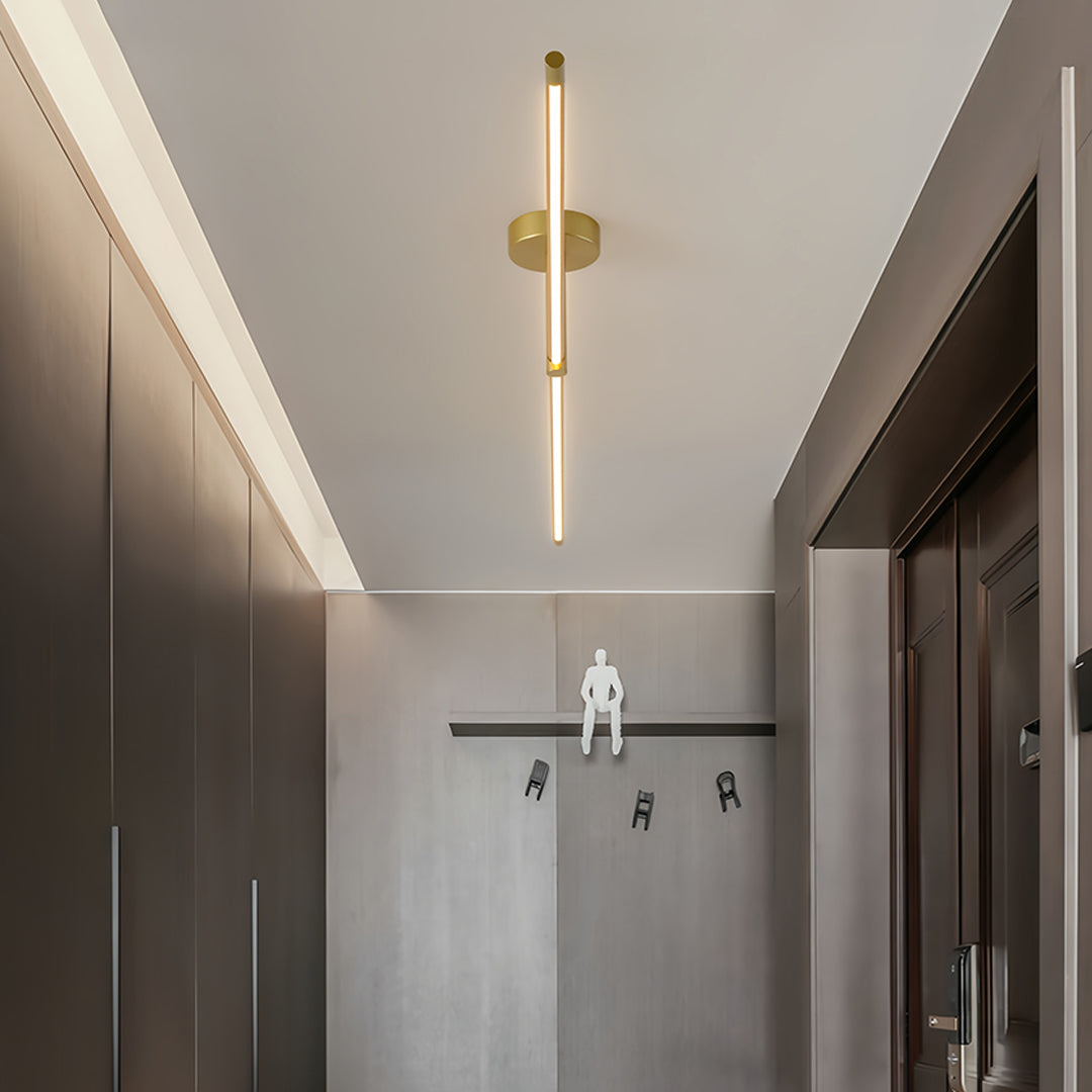 Minimalist linear semi flush mount light providing even light distribution in contemporary entrance area