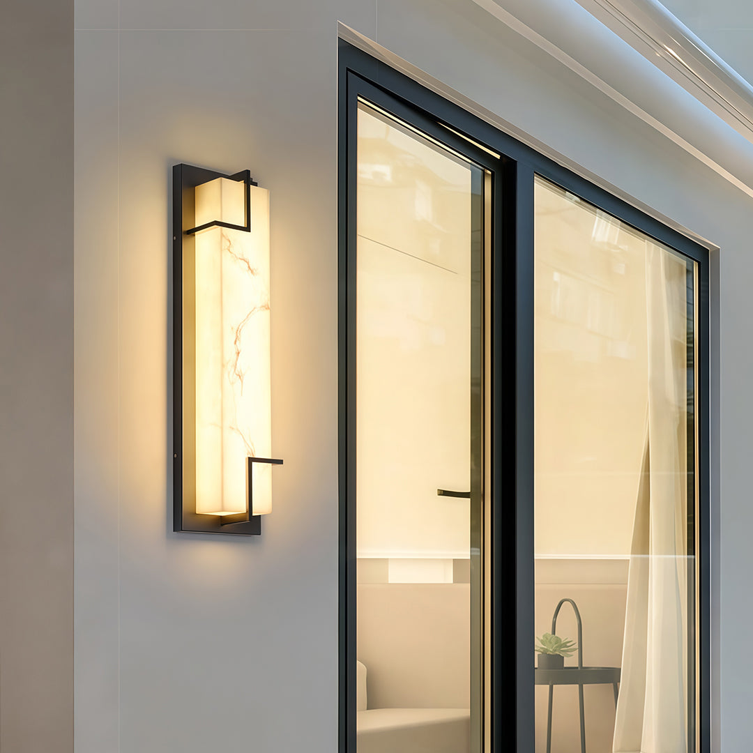 Minimalist exterior wall lights black featuring glass shade chandelier design creating warm ambient glow on white garage entrance.