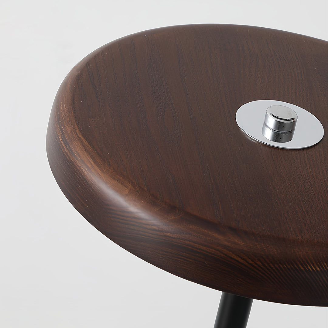 Minimalist floor lamp illuminating modern living room with warm ambient light beside contemporary furniture