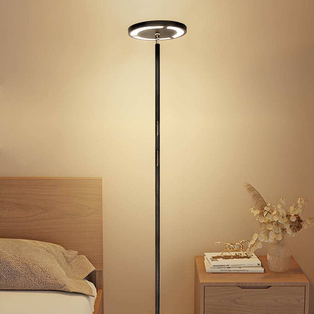 Minimalist floor light used as soft ambient light in bedroom.