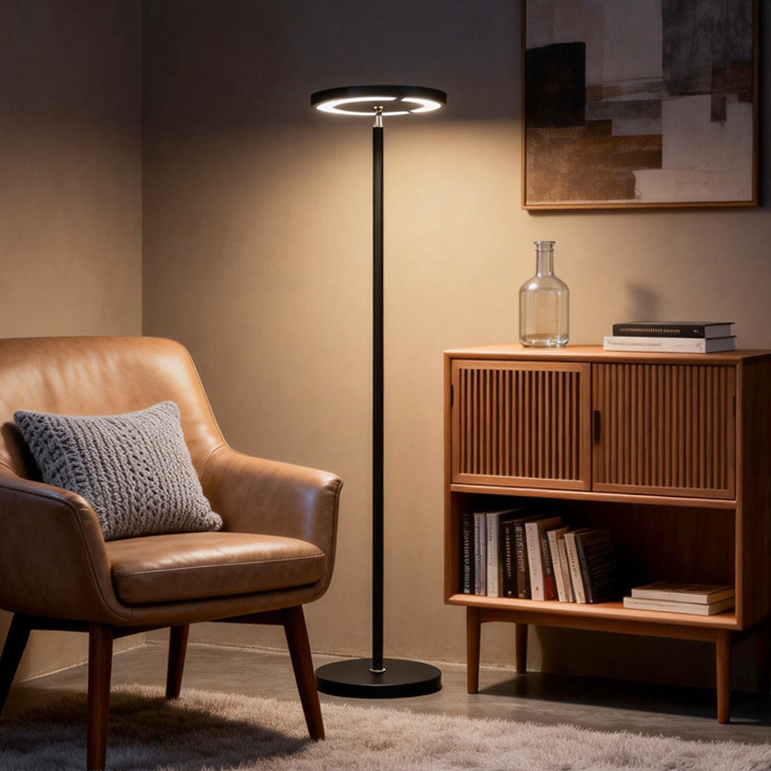 Minimalist floor light placed beside modern armchair in living room.