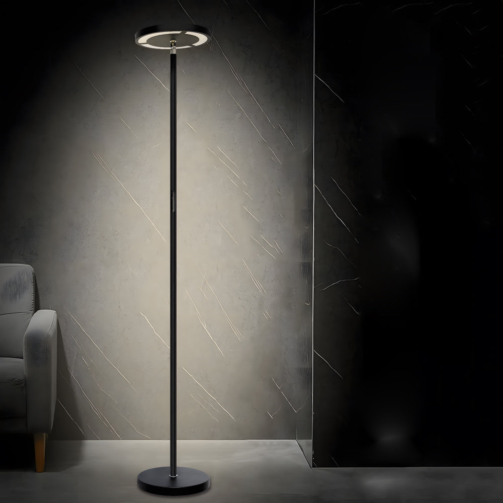 Minimalist floor light standing against dark modern interior wall.