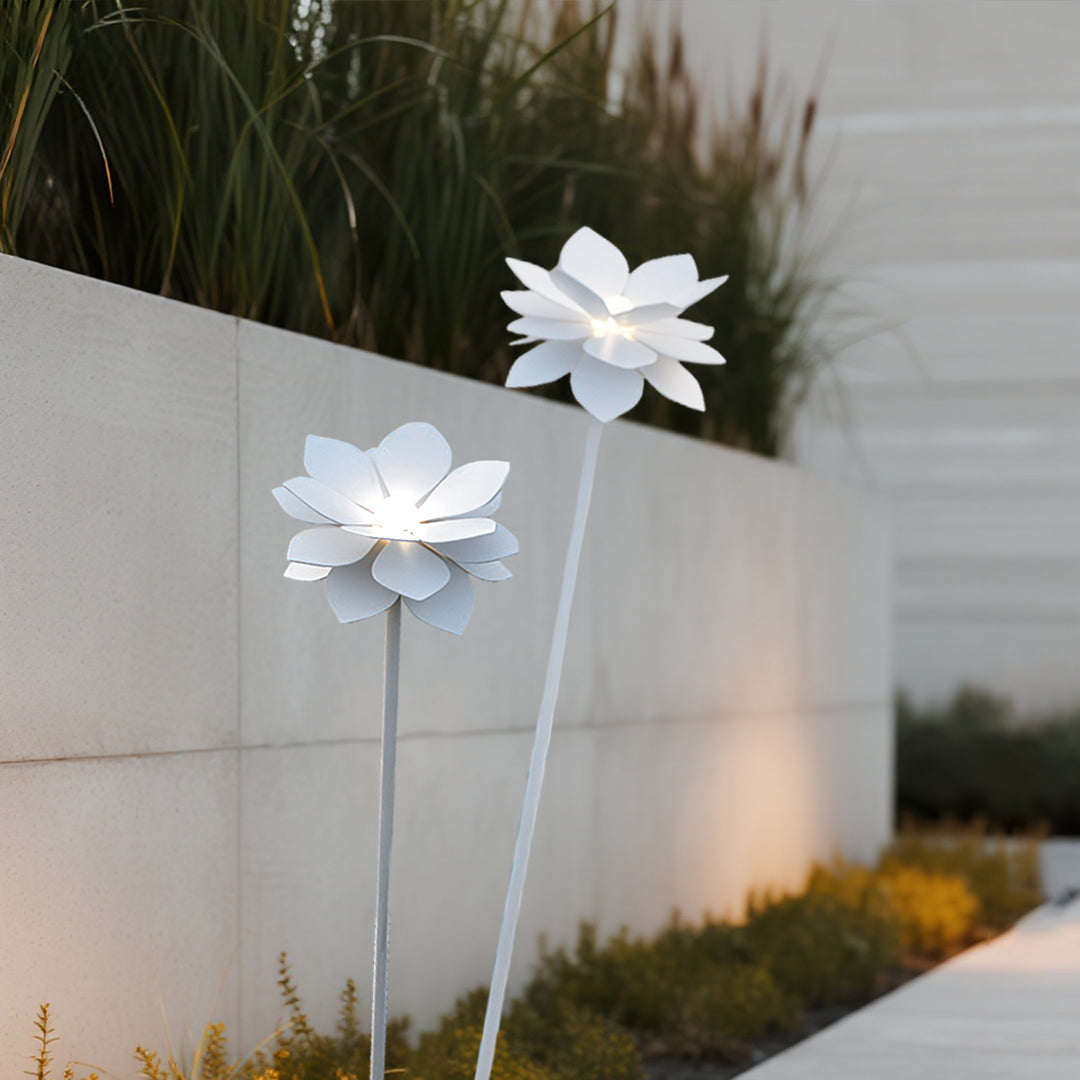Minimalist white flower landscape garden light against neutral wall providing subtle accent lighting for modern architecture