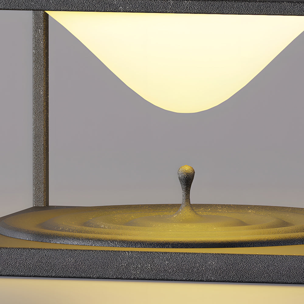 Silver Metal Table Lamp minimalist pillar light with geometric design and warm LED illumination on textured concrete surface