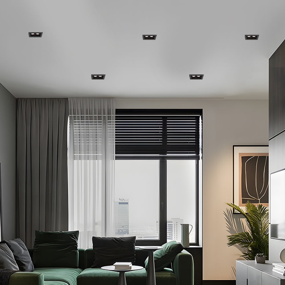 Minimalist hallway featuring recessed ceiling spot lights with black trim.