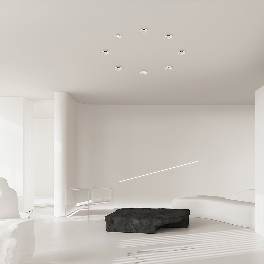 Minimalist interior spotlights featuring glass shade chandelier aesthetic creating serene ambiance in all-white bedroom.