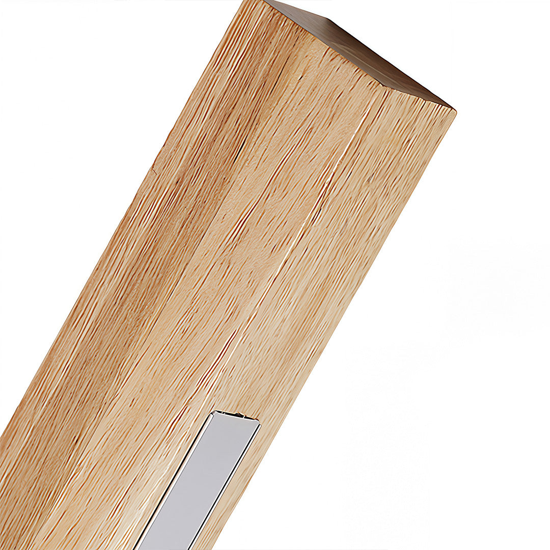 Light natural wood Japanese wall light fixture illuminating a bedside area with a cushioned headboard, showing soft glow. 