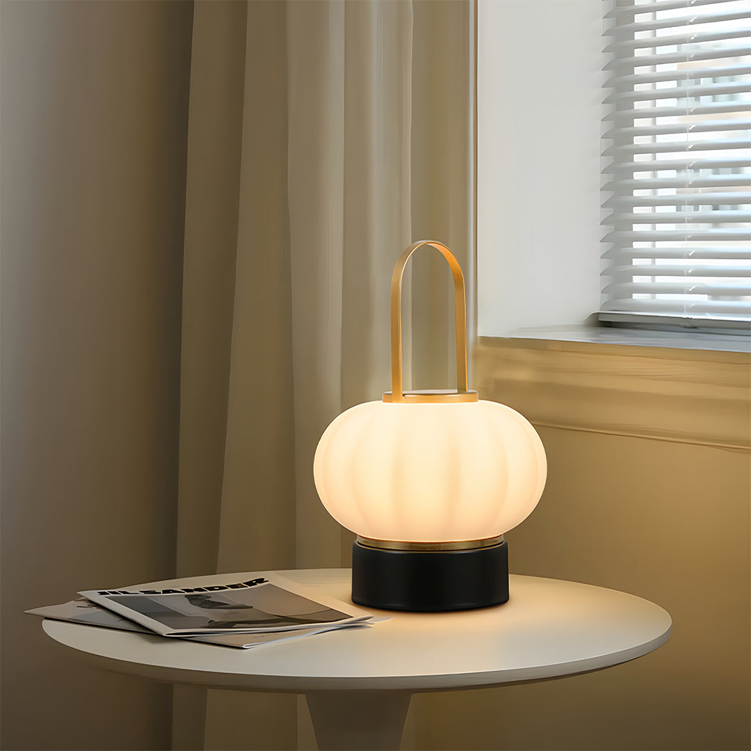 Minimalist lantern table lamp on side table creating gentle illumination in contemporary space