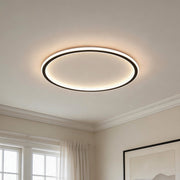 Minimalist led circle ceiling lamp featuring a thin black frame and a warm glowing inner halo.