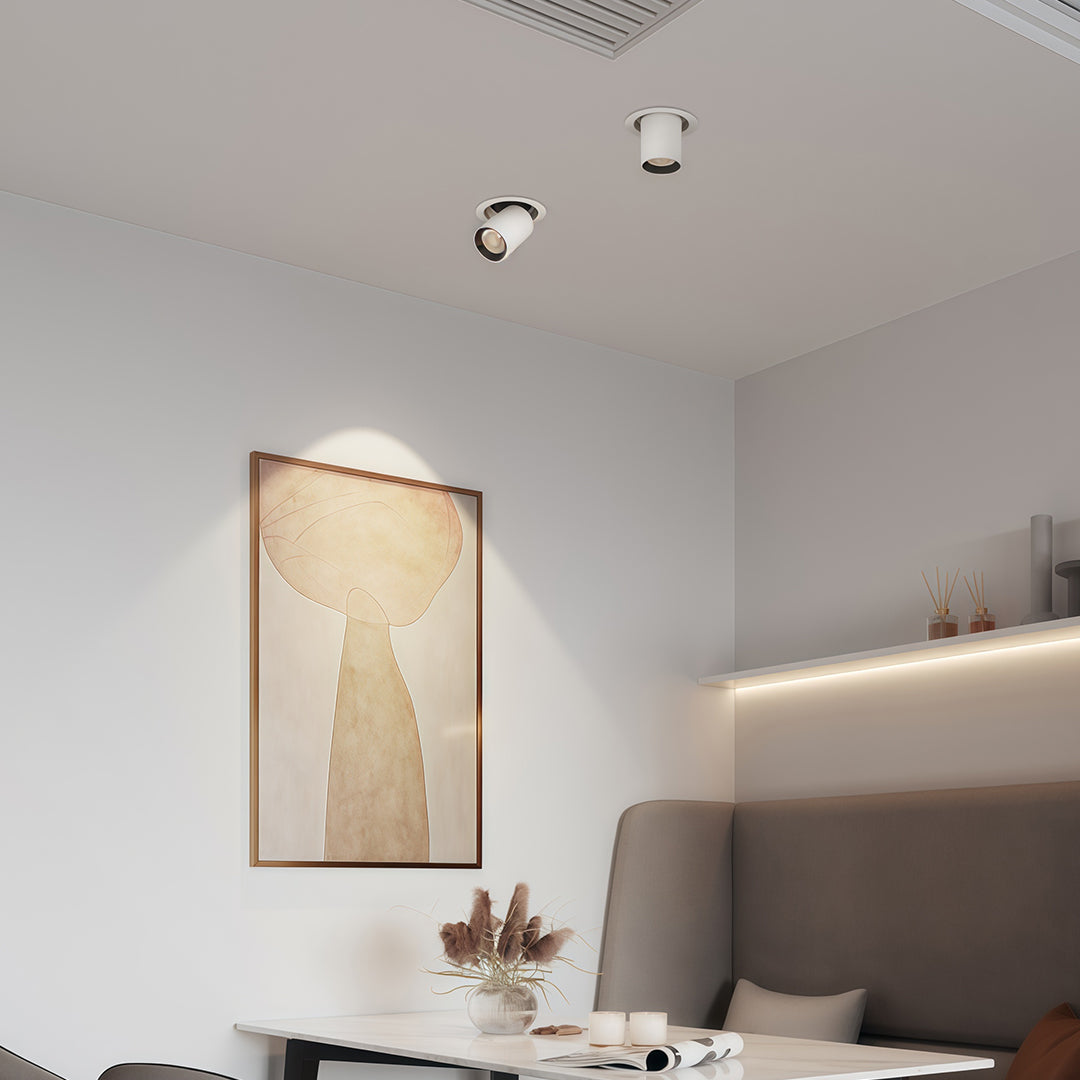 Minimalist LED indoor spotlights illuminating contemporary bedroom with glass shade chandelier style soft ambient glow.