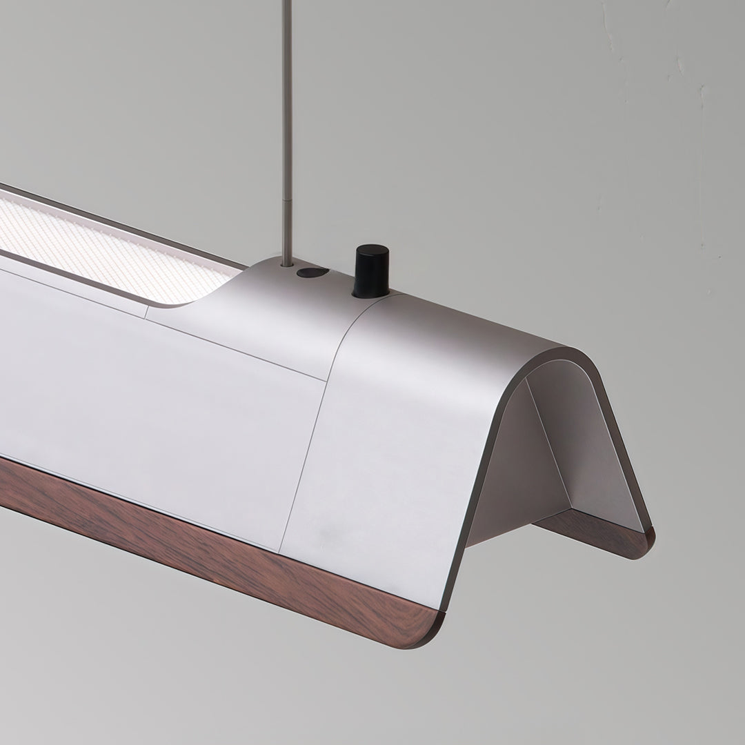 Minimalist LED linear suspension lighting featuring integrated diffuser and suspended cable design.