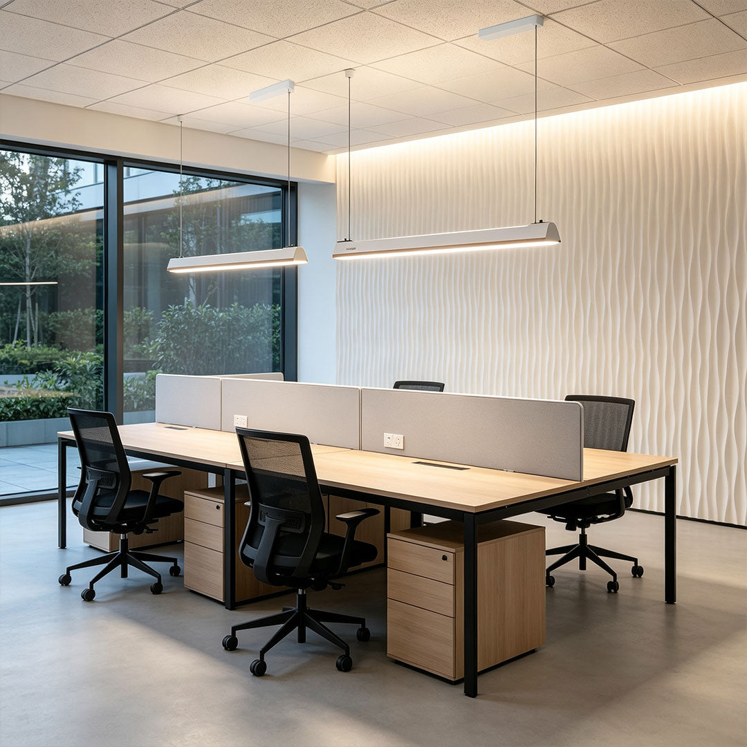Minimalist LED linear suspension lighting for modern office workspace interiors.