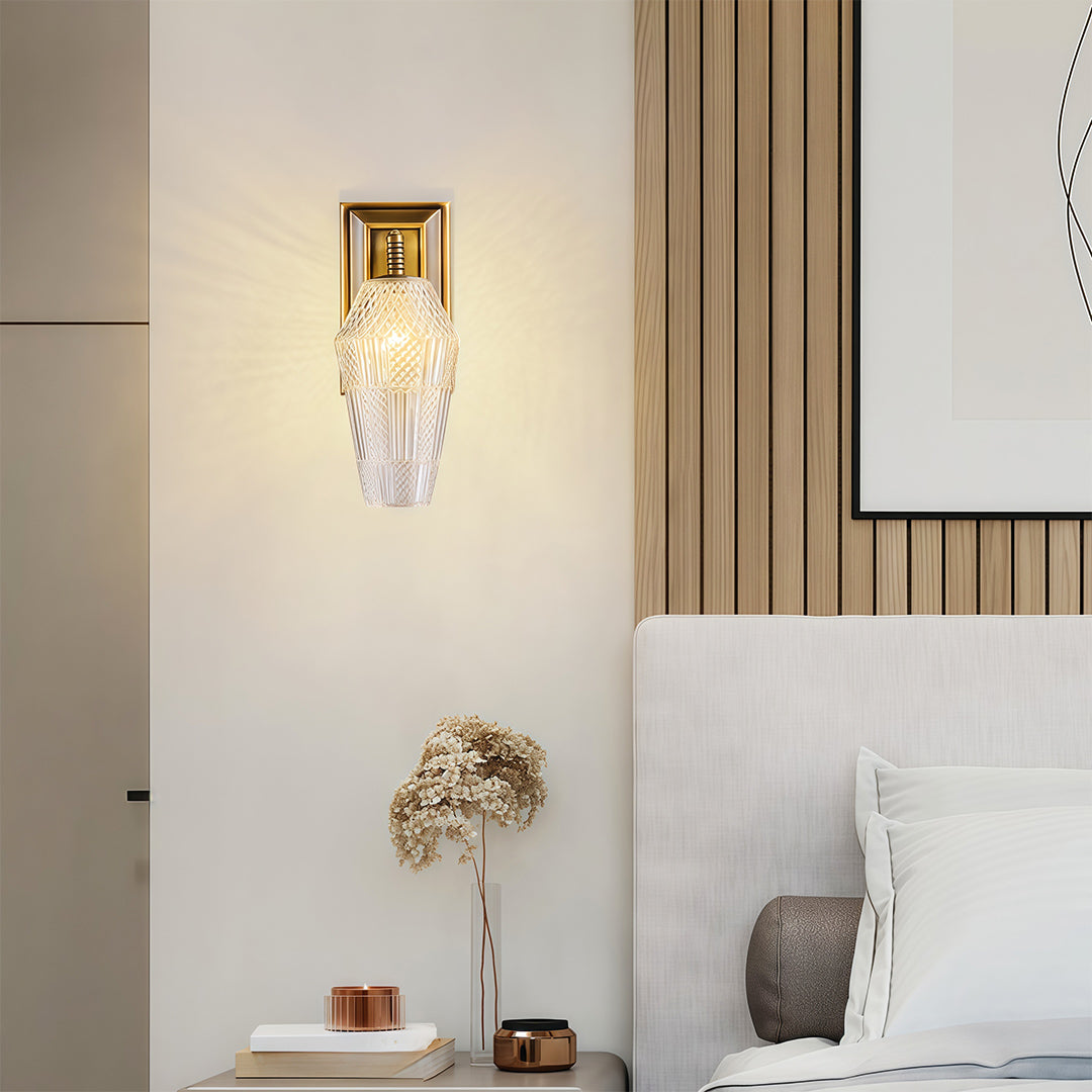 Minimalist LED wall sconce lights with glass shade chandelier design creating soft ambient glow in neutral bedroom interior.