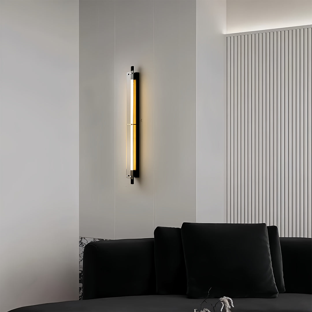 Minimalist wall design featuring slim led wall strip lights mounted vertically beside a sofa for warm accent illumination.