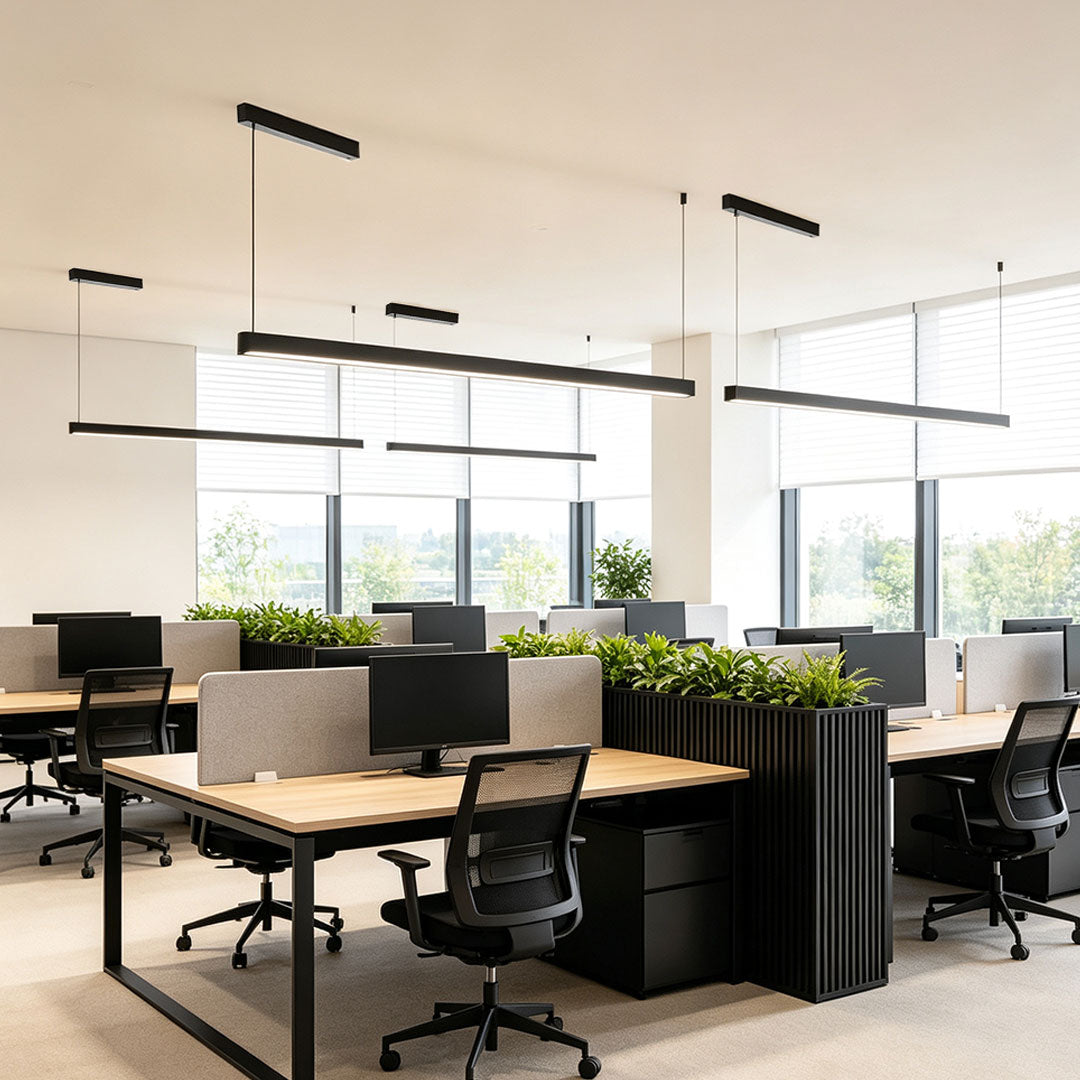 Minimalist linear suspension light for modern open office workspace lighting.