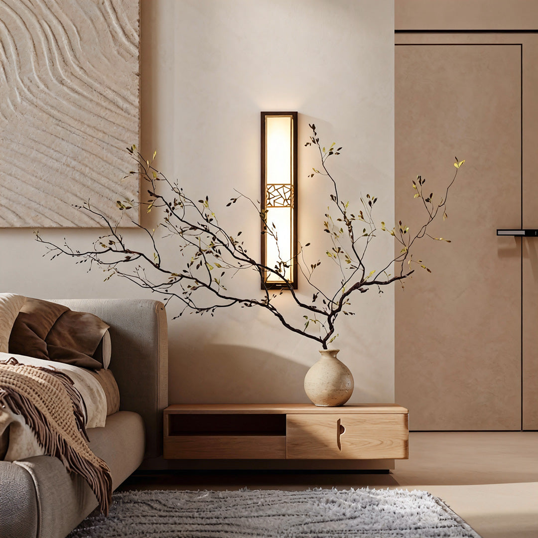 Minimalist linear wall lighting fixture beside a bed, offering a sleek and functional lighting solution for bedrooms.