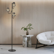 Minimalist living room featuring sculptural floor lamp with multiple glass shades and clean aesthetic