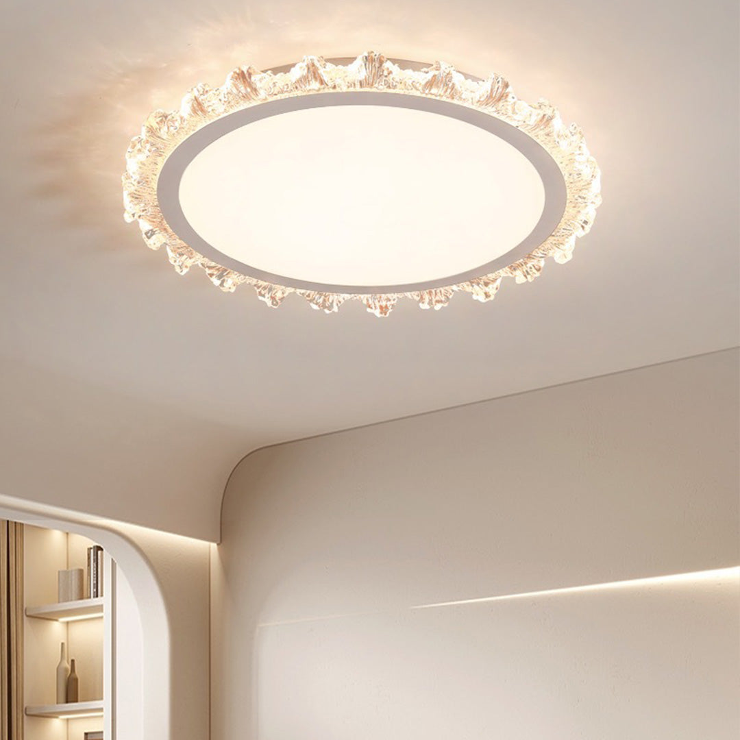 Elegant white round led ceiling light with crystal edges lighting a minimalist modern hallway.